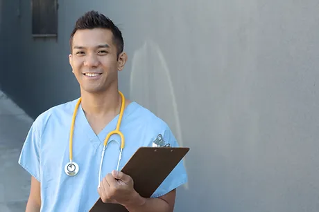 Healthcare professional holding clipboard and smiling during a workplace health check.