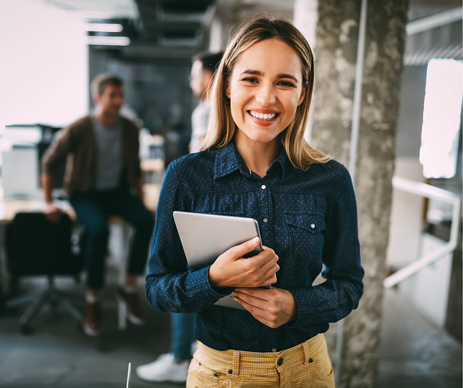 Smiling employee holding a tablet in a modern office, symbolising workplace retention success.